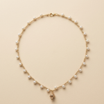 Collana pumo pugliese in pietra con perle bianche e dettagli artigianali handmade